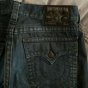 True Religion Ricky Fit, straight leg silhouette. Dark wash jeans.